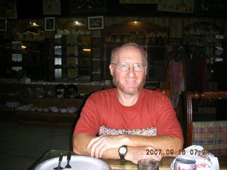 309 69e. Adam at dinner in India