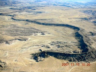 135 6bf. Flying with LaVar Wells - river bed raised *above* surrounding land - aerial