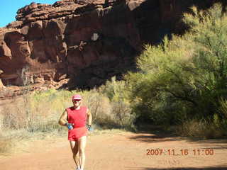 180 6bg. Canyonlands National Park - Lathrop Trail hike - Adam (tripod) running