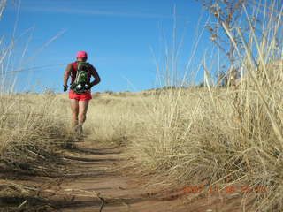 356 6bg. Canyonlands National Park - Lathrop Trail hike - Adam (tripod) running