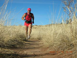 357 6bg. Canyonlands National Park - Lathrop Trail hike - Adam (tripod) running