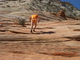 95 6ev. Zion National Park - slickrock hill - Adam going up