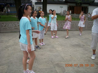 53 6kv. eclipse - Shanghai - Zhu Jia Jiao village - girls joining us for Tai Chi