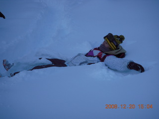 81 6ql. Zion National Park - Angels Landing hike - Debbie making snow angel