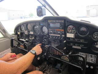 Adam's hands on N8377W controls, plus instruments