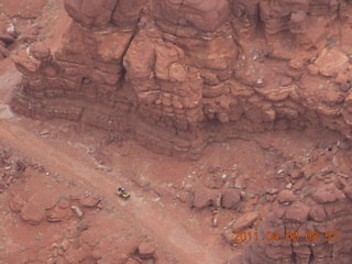 61 7j8. Anticline Overlook - someone driving on dirt road below