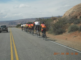 139 7j9. Arches National Park drive - pack of bicyclists