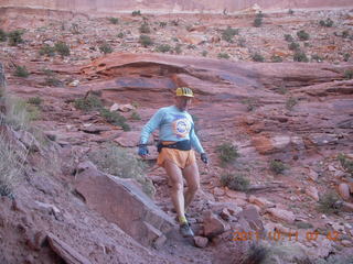 38 7qb. Canyonlands National Park - Lathrop trail hike - Adam hiking (tripod)