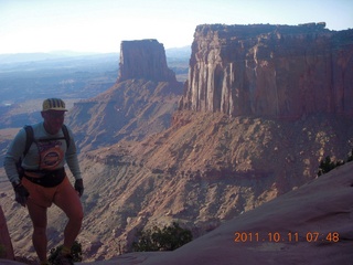 43 7qb. Canyonlands National Park - Lathrop trail hike - Adam hiking (tripod)