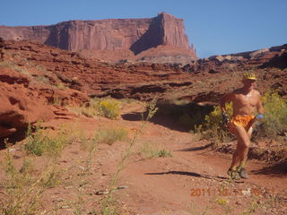87 7qb. Canyonlands National Park - Lathrop trail hike - Adam running (tripod)