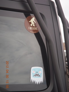 151 7ww. stickers on a neighbor car