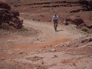 176 7x3. Harrah Pass drive back - mountain biker at the pass