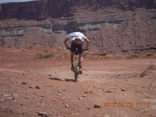 179 7x3. Harrah Pass drive back - mountain biker at the pass
