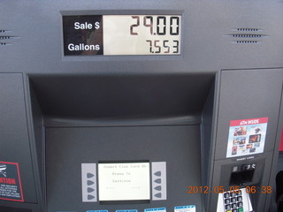 2 7x5. topping off the car's gas tank