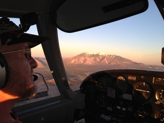 Adam flying N8377W