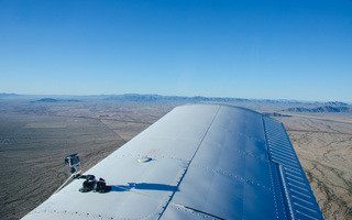 Yaseen's pictures - Adam's video camera on the wing of N8377W