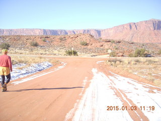 77 8v3. driving from Fisher Towers hike - Adam running (back) - tripod and timer
