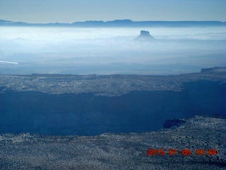 90 8v6. aerial - snowy canyonlands - haze into the sun