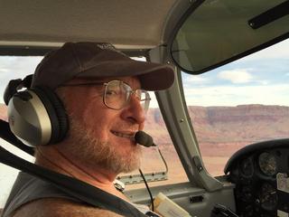 Adam flying N8377W
