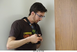 Brian taking a picture of wrong-way door handle