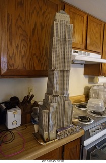 my cardboard Empire State  Building trashed by my cat Max
