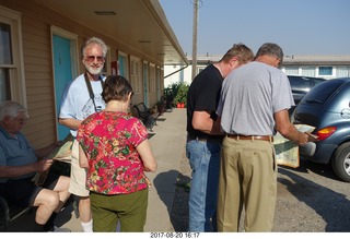 76 9sl. Thermopolis El Rancho Motel - eclipse friends - Howard, Louise, and others reading a map