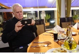 15 a0f. Peru - Aranwa Sacred Valley hotel - friend taking picture of oil and vinagar dispenser