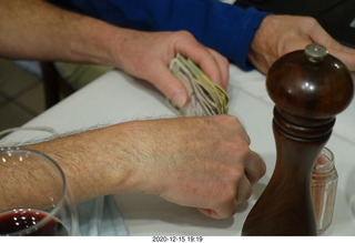 150 a0y. Argentina - Buenos Aires - counting the money for the bill