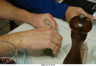 151 a0y. Argentina - Buenos Aires - counting the money for the bill