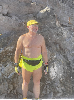 Adam shirtless atop North Mountain hike