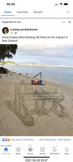 piano drawn in shells on the beach