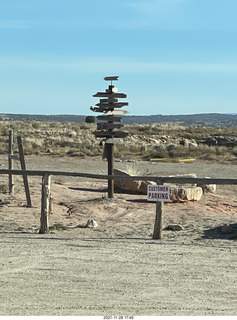 63 a19. driving to cny airport - sign cairn