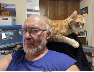 Adam with my cat Devin on my lap