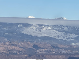311 a1n. aerial - canyonlands - back to canyonlands field (cny) - clouds on Lasalle Mountains