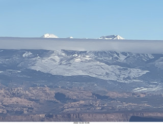 312 a1n. aerial - canyonlands - back to canyonlands field (cny) - clouds on Lasalle Mountains