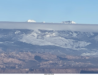 313 a1n. aerial - canyonlands - back to canyonlands field (cny) - clouds on Lasalle Mountains