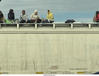 10 a24. Torreon - Mexicans riding the tops of freight-train cars