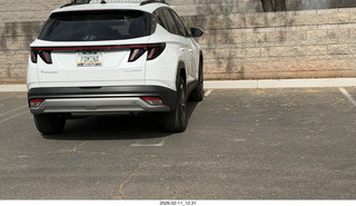 car in two spaces
